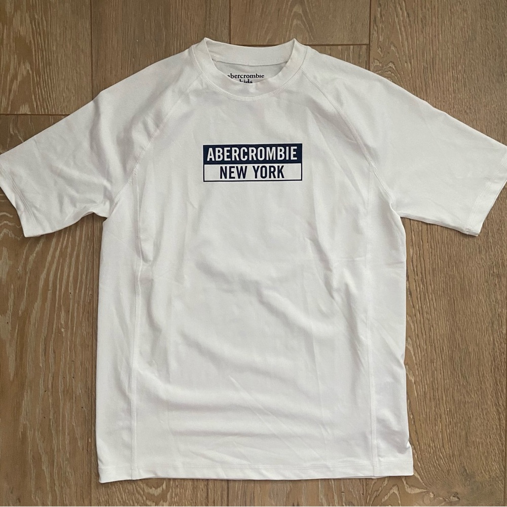 Abercrombie & Fitch Rashguard (kids 14, women’s small) 
Never worn, brand new